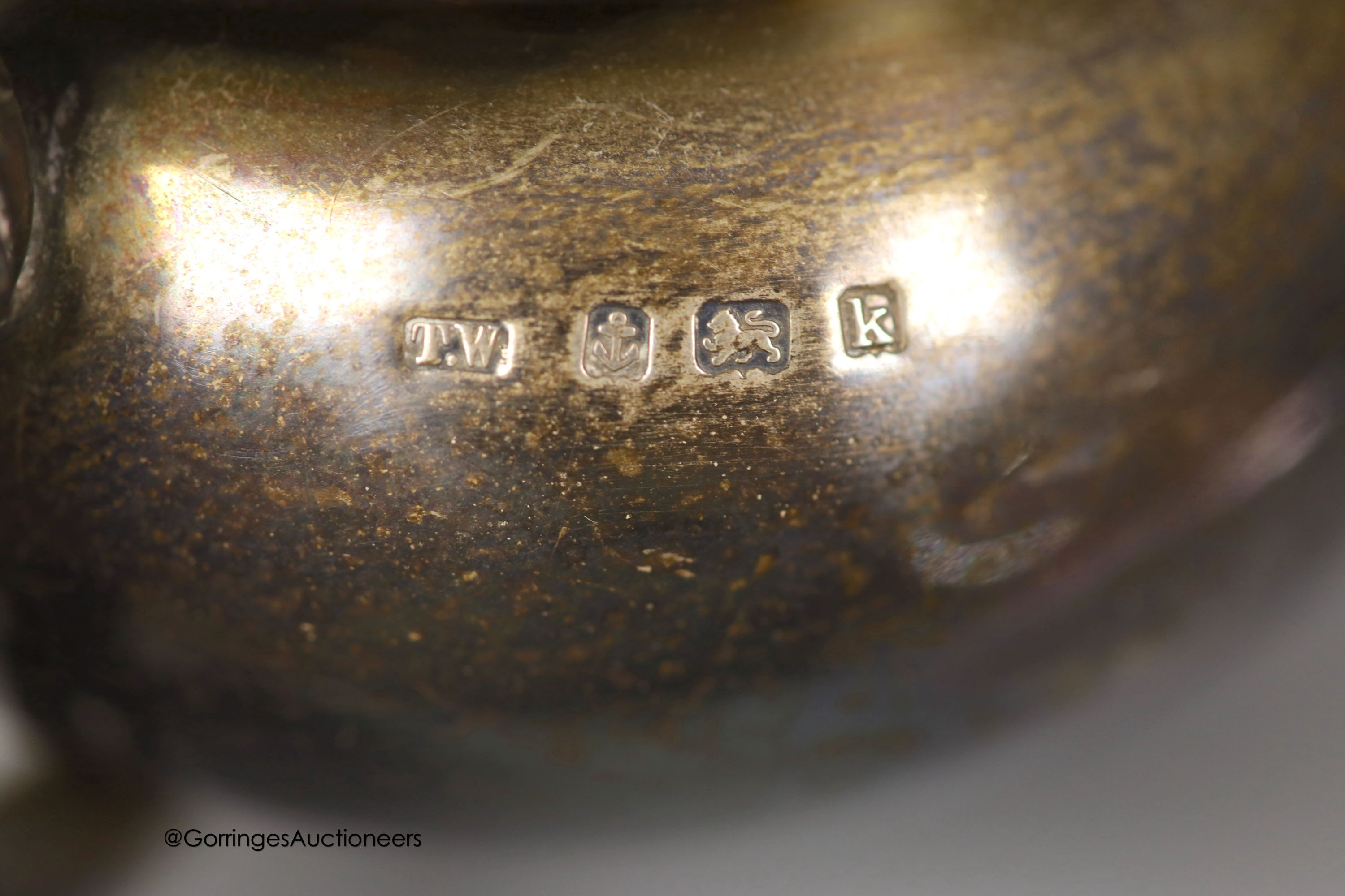 An Edwardian silver bachelor's squat circular teapot, T. Wooley, Birmingham, 1909, gross 9.5oz.